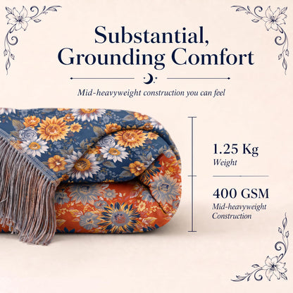 Folded blue and orange sunflower patterned fringed throw in a "Substantial, Grounding Comfort" graphic labeled 1.25 kg and 400 GSM.