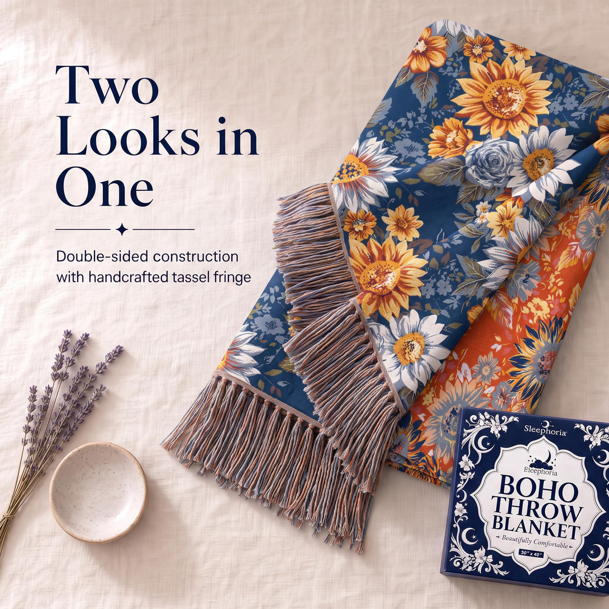 Folded corner of a blue and orange sunflower patterned throw showing its contrasting reverse and fringe beneath "Two Looks in One".